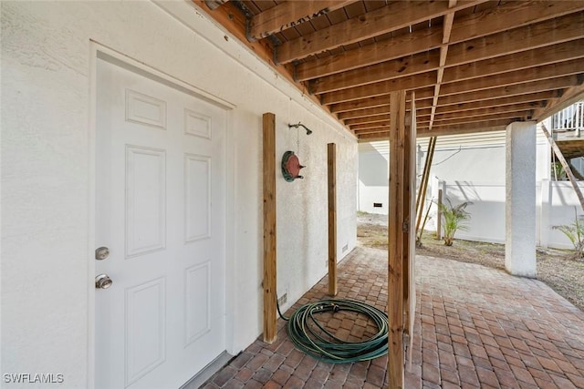 doorway to property with a patio