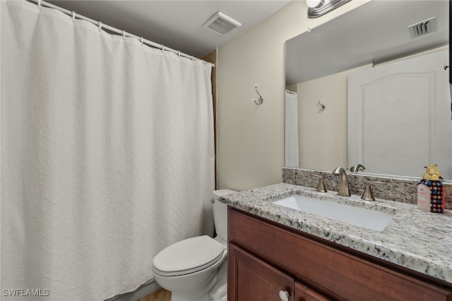 7025 Dennis Cir Unit G104, Naples, FL 34104 - bathroom featuring toilet and vanity