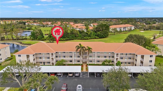 birds eye view of property with a water view