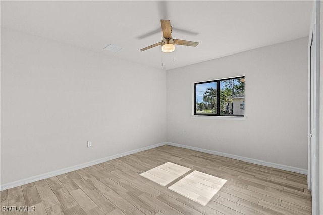 unfurnished room with ceiling fan and light hardwood / wood-style floors