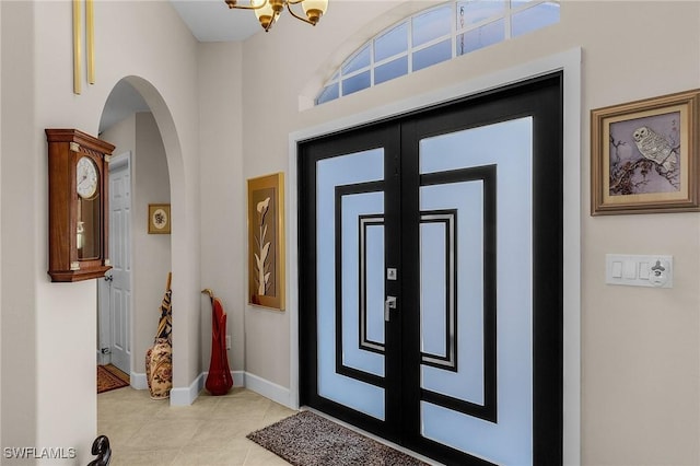 entrance foyer with french doors and light tile patterned flooring