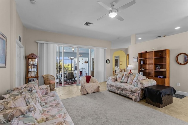 living room with ceiling fan and light tile patterned floors