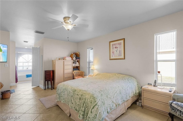 bedroom featuring light tile patterned flooring and ceiling fan