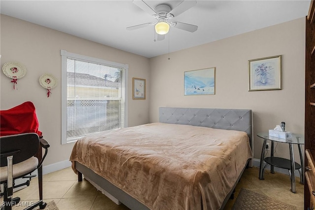 tiled bedroom with ceiling fan