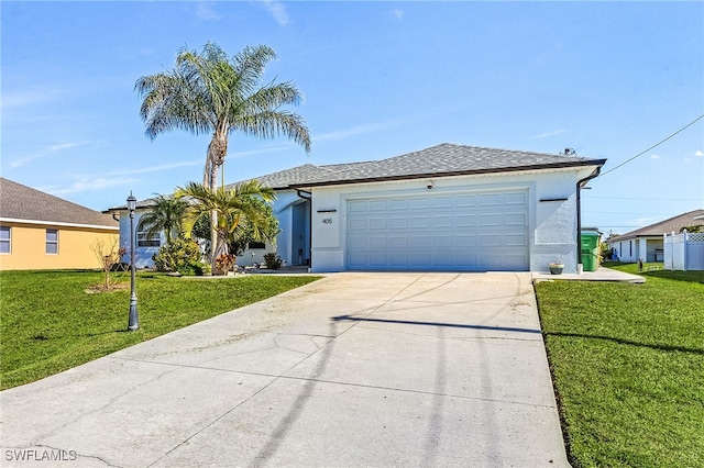 single story home featuring a garage and a front yard