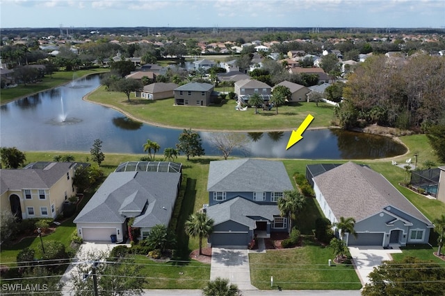 birds eye view of property with a residential view and a water view