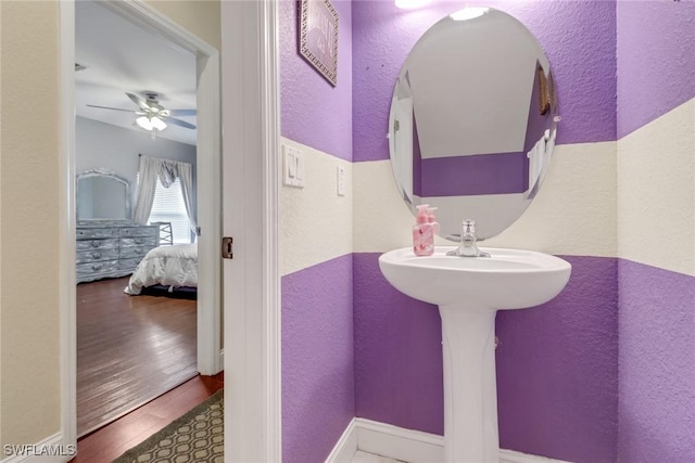 13380 Hampton Park Ct, Fort Myers, FL 33913 - ensuite bathroom featuring a textured wall, ceiling fan, and wood finished floors