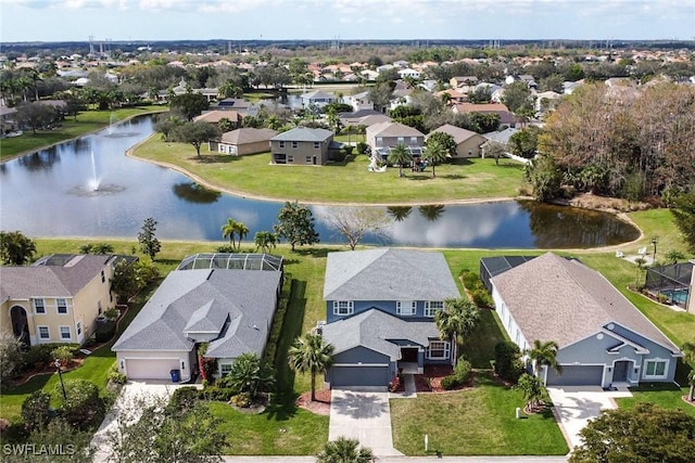 aerial view with a residential view and a water view