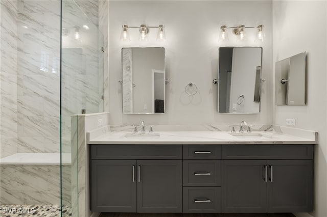 bathroom featuring vanity and tiled shower