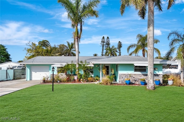 ranch-style home with a garage and a front yard