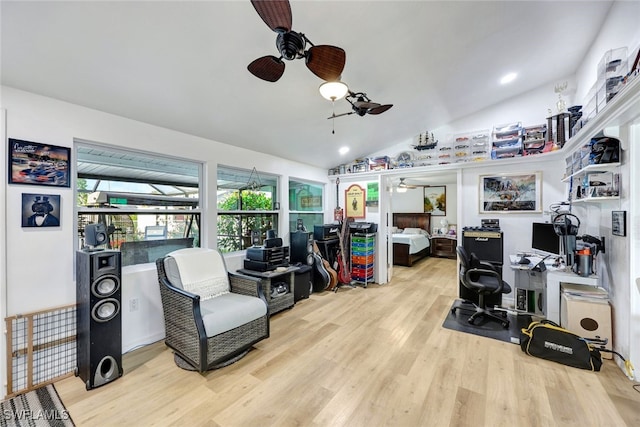 office area with lofted ceiling, light hardwood / wood-style floors, and ceiling fan