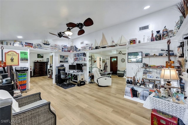 misc room featuring vaulted ceiling, light hardwood / wood-style floors, and ceiling fan