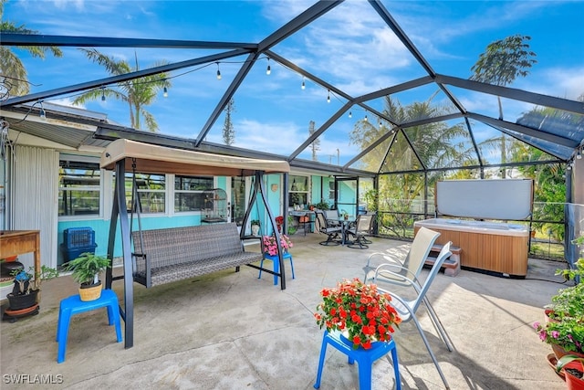 view of patio / terrace featuring an outdoor living space, a hot tub, and glass enclosure