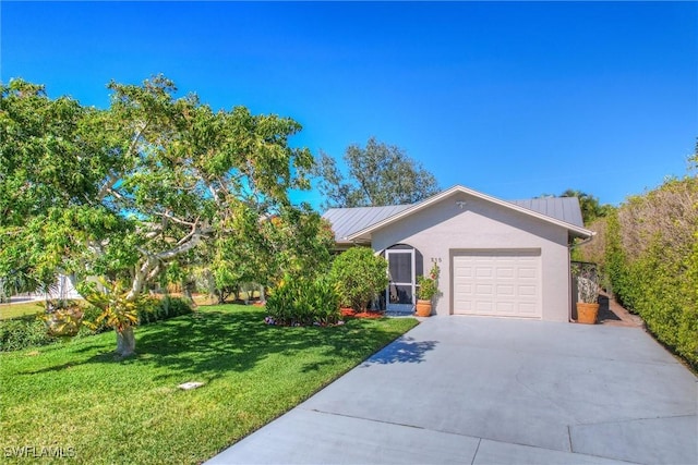 single story home featuring a garage and a front yard