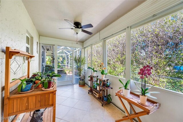 sunroom with ceiling fan and a wealth of natural light