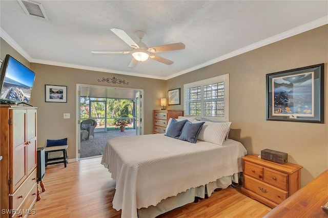 bedroom with crown molding, access to exterior, light hardwood / wood-style floors, and multiple windows