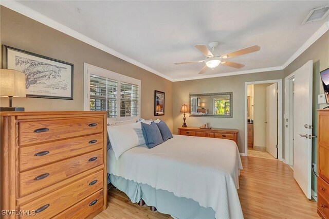 bedroom featuring crown molding, light hardwood / wood-style floors, and ceiling fan