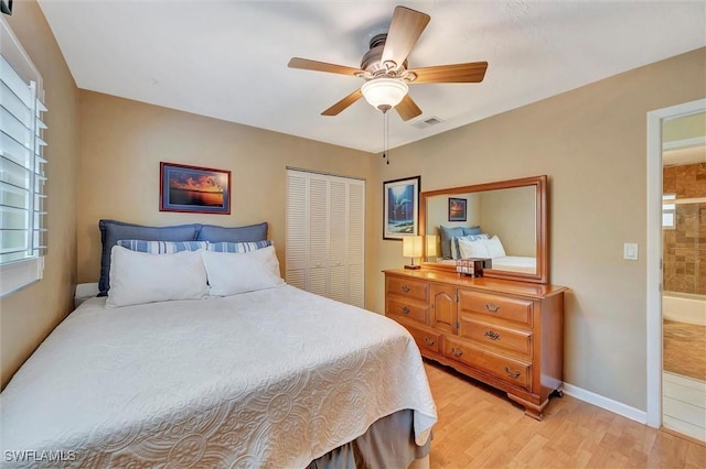 bedroom with ceiling fan, light hardwood / wood-style floors, and a closet