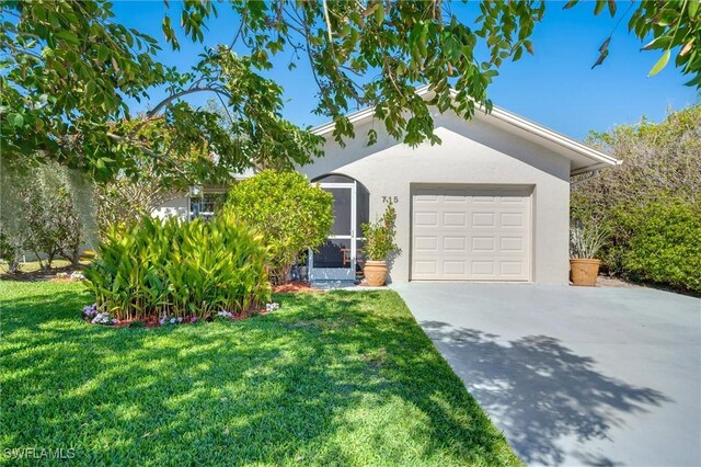 ranch-style home with a garage and a front yard