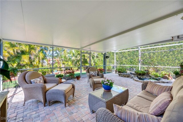715 96th Ave N, Naples, FL 34108 - sunroom / solarium featuring an outdoor hangout area