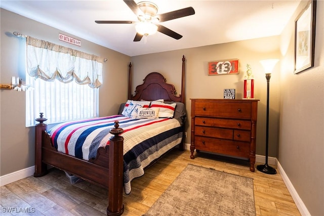 bedroom with wood-type flooring and ceiling fan