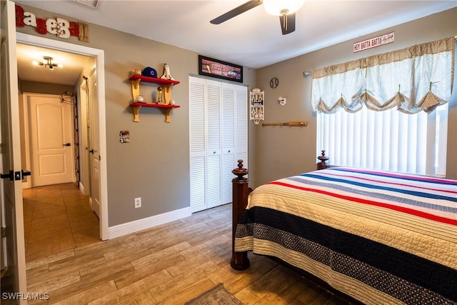 bedroom with ceiling fan, hardwood / wood-style floors, and a closet