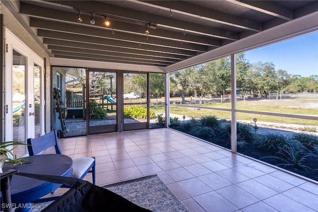 unfurnished sunroom featuring a healthy amount of sunlight