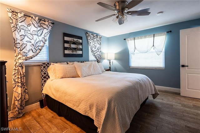 bedroom featuring hardwood / wood-style flooring and ceiling fan