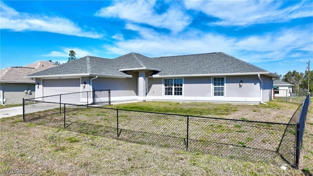 ranch-style house featuring a garage and a front yard