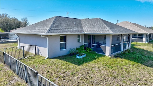 view of side of property featuring a sunroom and a lawn