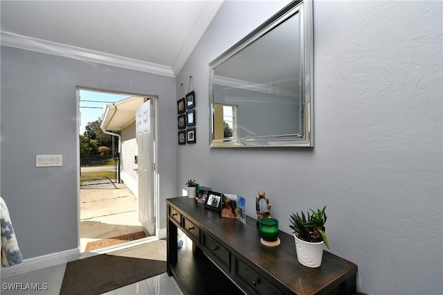 doorway to outside featuring crown molding