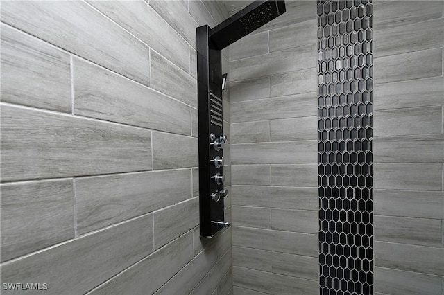 details with a tile shower