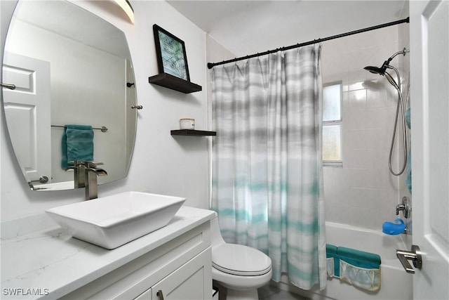 full bathroom featuring shower / bath combo, vanity, and toilet