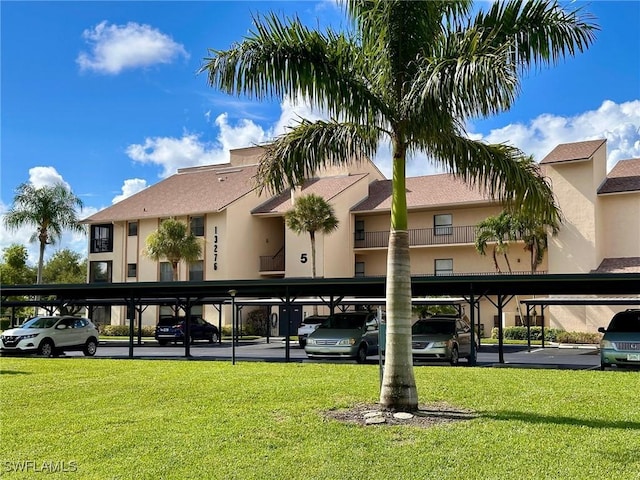 view of property featuring covered parking