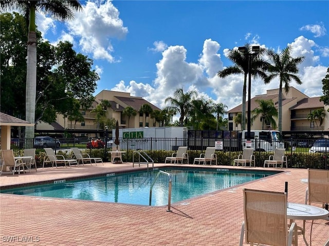 view of swimming pool with a patio