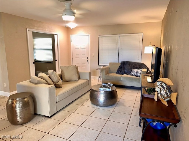 living room with light tile patterned floors and ceiling fan