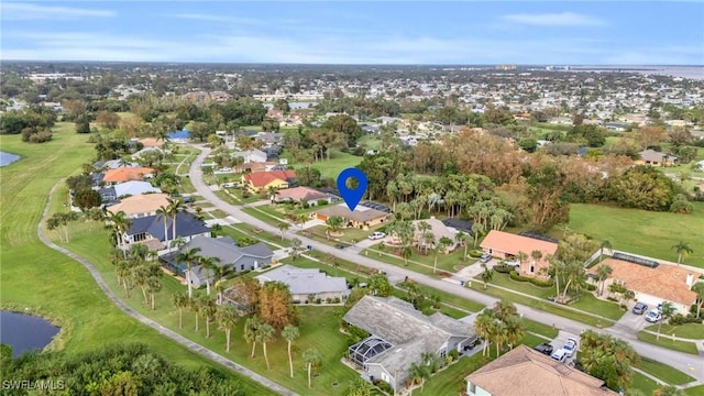 drone / aerial view featuring a residential view and a water view