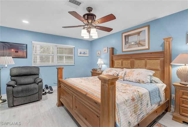 bedroom with ceiling fan and light wood-type flooring