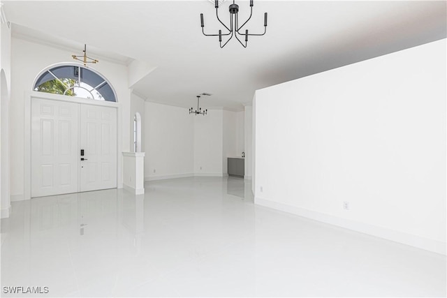 entryway with an inviting chandelier