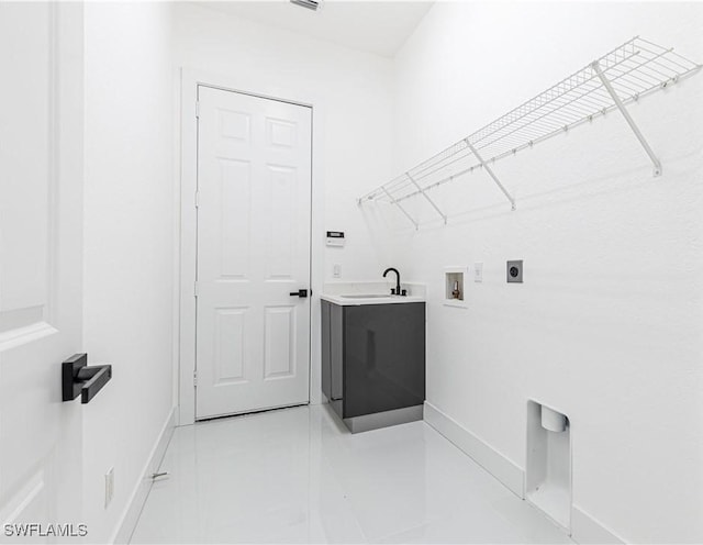 4273 18th St NE, Naples, FL 34120 - laundry room featuring hookup for an electric dryer, hookup for a washing machine, and baseboards