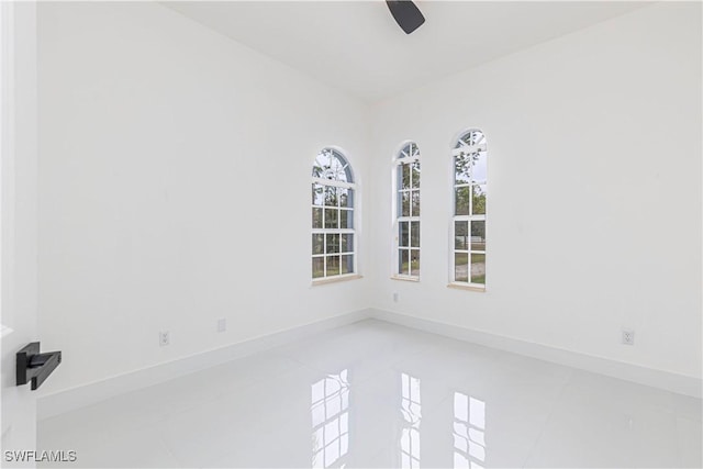 4273 18th St NE, Naples, FL 34120 - tiled empty room with a ceiling fan and baseboards