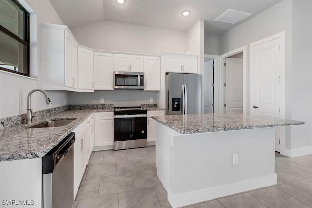 kitchen featuring white cabinetry, appliances with stainless steel finishes, and a sink