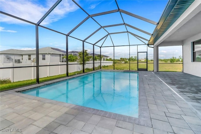 pool featuring a lanai and a patio