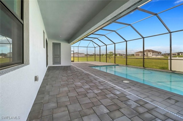 outdoor pool with a patio and a lanai