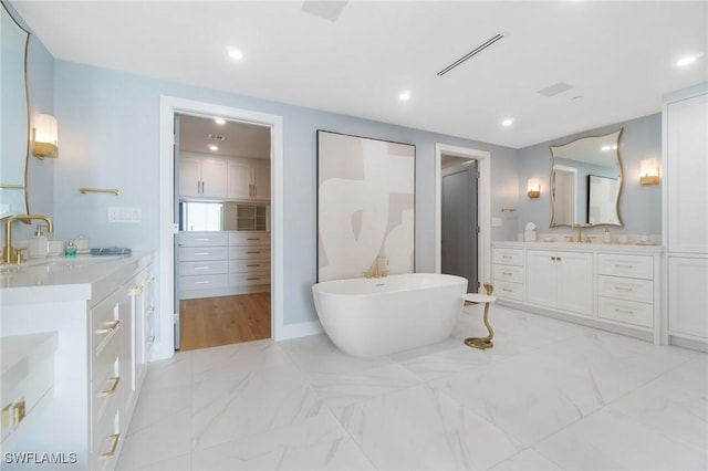 bathroom featuring vanity and a bathtub