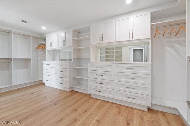 spacious closet featuring light wood-type flooring