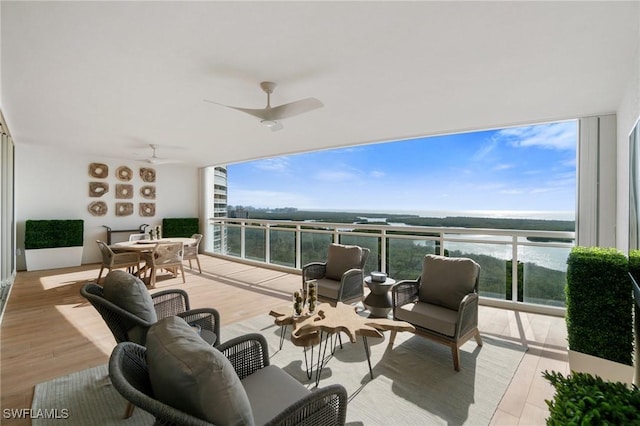 view of patio / terrace with a balcony and ceiling fan