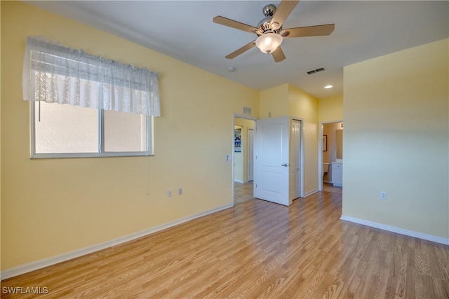 unfurnished bedroom with ceiling fan, a closet, and light wood-type flooring