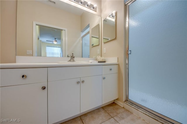 bathroom with vanity, tile patterned flooring, and a shower with shower door