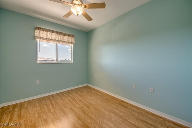 spare room with ceiling fan and light hardwood / wood-style flooring